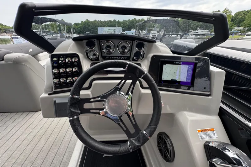 Slide: The Image of Steering console of 2023 Starcraft MX 25 DL DH boat with navigation display. - 36