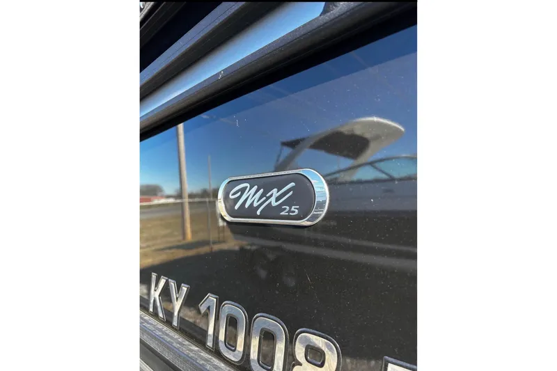 Slide: The Image of 2023 Starcraft MX 25 DL DH boat emblem with reflective surface. - 46