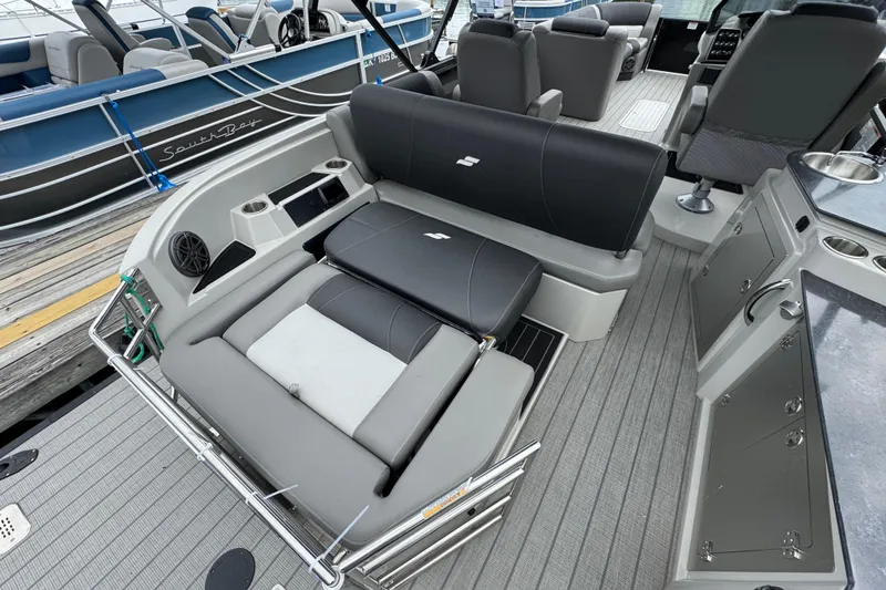 Slide: The Image of 2023 Starcraft MX 25 DL DH boat interior with luxurious seating and modern amenities. - 9