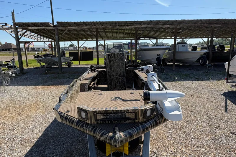 Slide: The Image of 2022 Prodigy 18' PRO VS boat in a covered storage area, front view. - 10