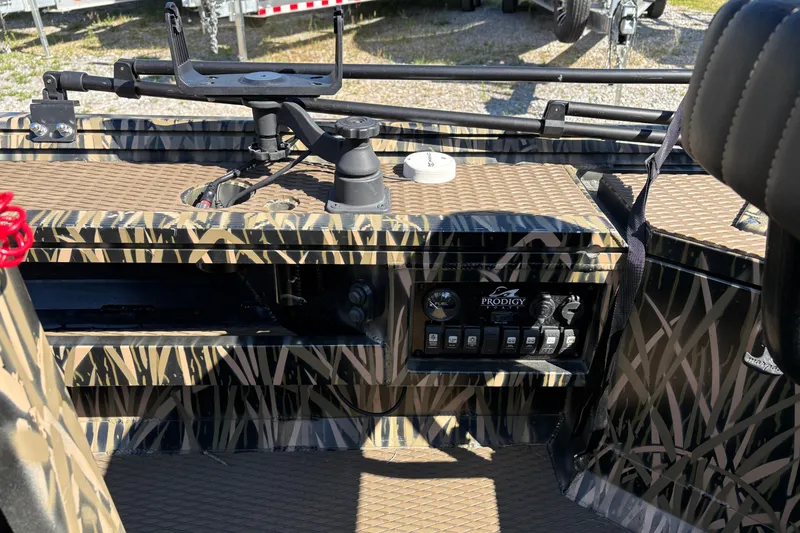 Slide: The Image of Interior of 2022 Prodigy 18' PRO VS boat with camouflage design and control panel. - 12