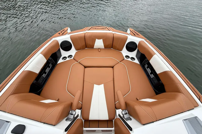 Slide: The Image of Luxurious interior of 2023 Malibu Wakesetter 24 MXZ boat with tan and white seating. - 22