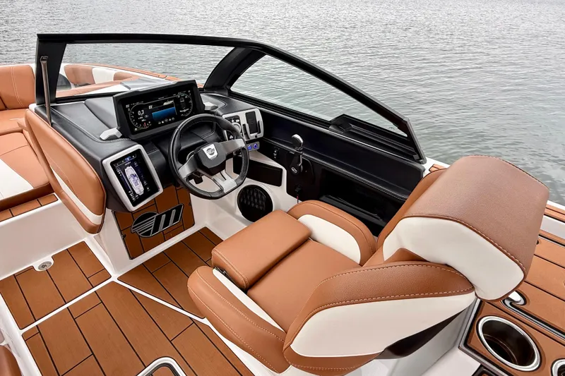 Slide: The Image of 2023 Malibu Wakesetter 24 MXZ boat interior with modern dashboard and luxurious seating. - 23