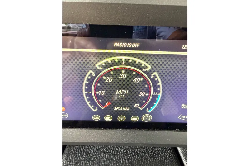 Slide: The Image of Dashboard display of 2023 Malibu Wakesetter 24 MXZ showing speedometer and controls. - 34