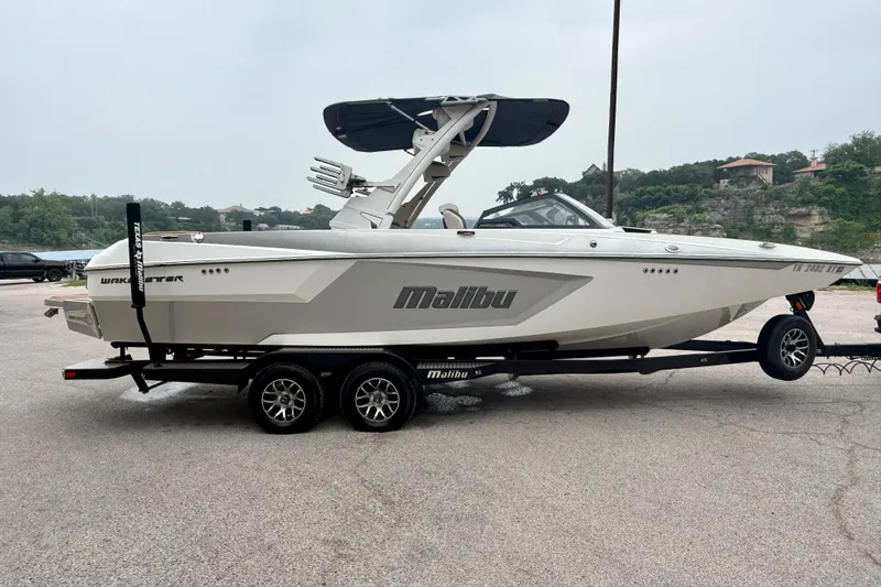 Slide: The Image of 2023 Malibu Wakesetter 24 MXZ boat on trailer, side view. - 9