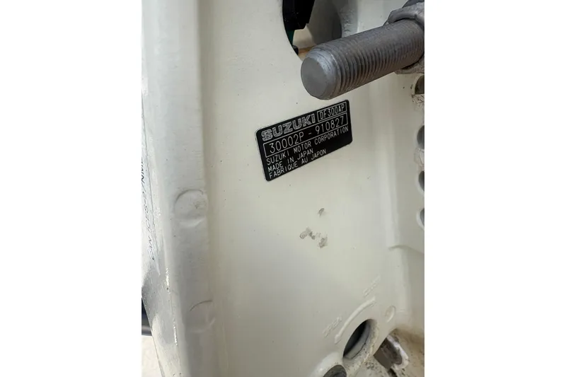 Slide: The Image of Close-up of Suzuki DF300AP engine label on 1998 Pursuit 2870 Center Console. - 13
