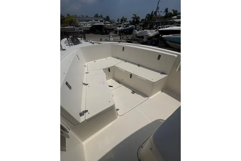 Slide: The Image of 1998 Pursuit 2870 Center Console boat interior with seating and storage compartments. - 20