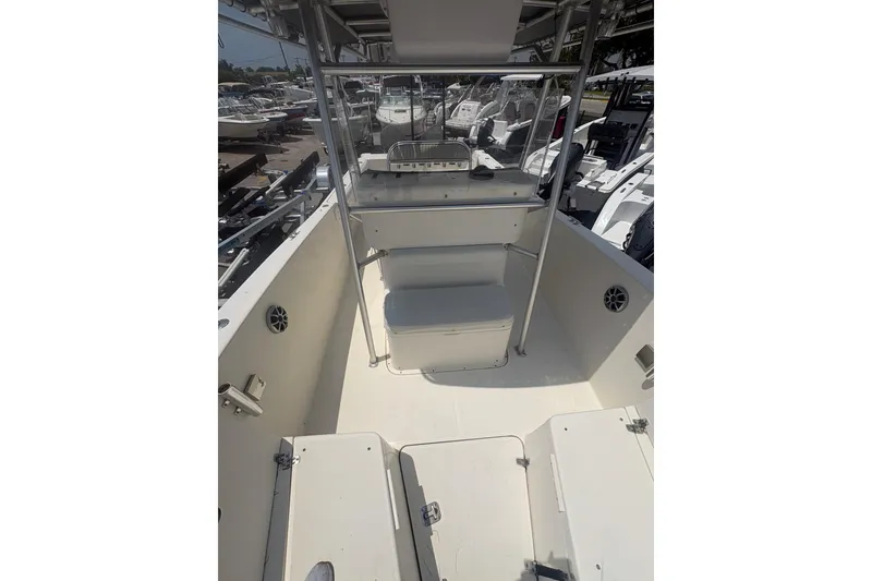 Slide: The Image of 1998 Pursuit 2870 Center Console boat interior with seating and console view. - 26