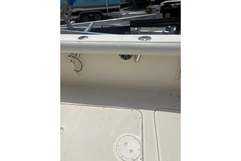 Slide: The Image of 1998 Pursuit 2870 Center Console boat interior with speaker and clean deck. - 33