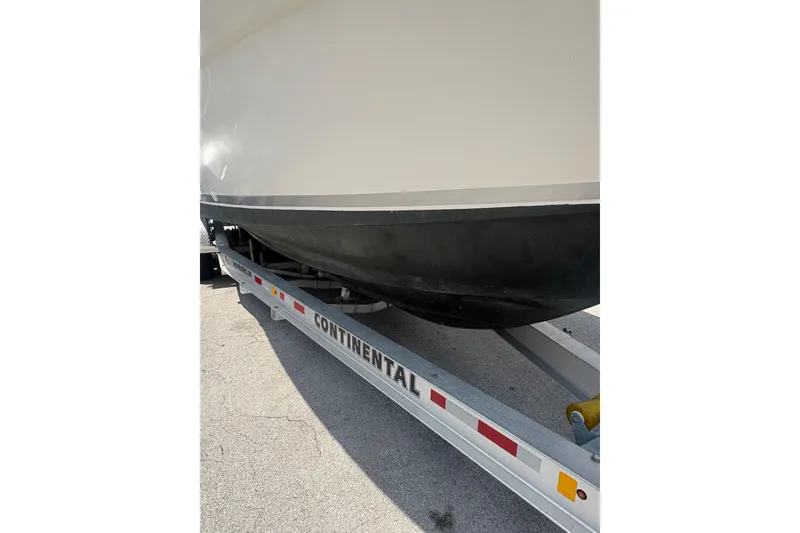 Slide: The Image of 1998 Pursuit 2870 Center Console boat on Continental trailer, side view. - 7