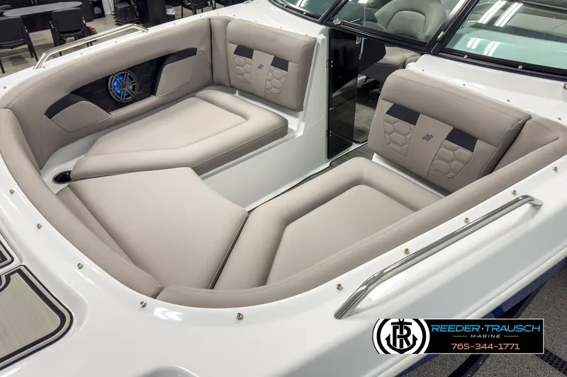 Slide: The Image of 2025 Four Winns HD3 boat interior with beige seating and speaker system. - 10