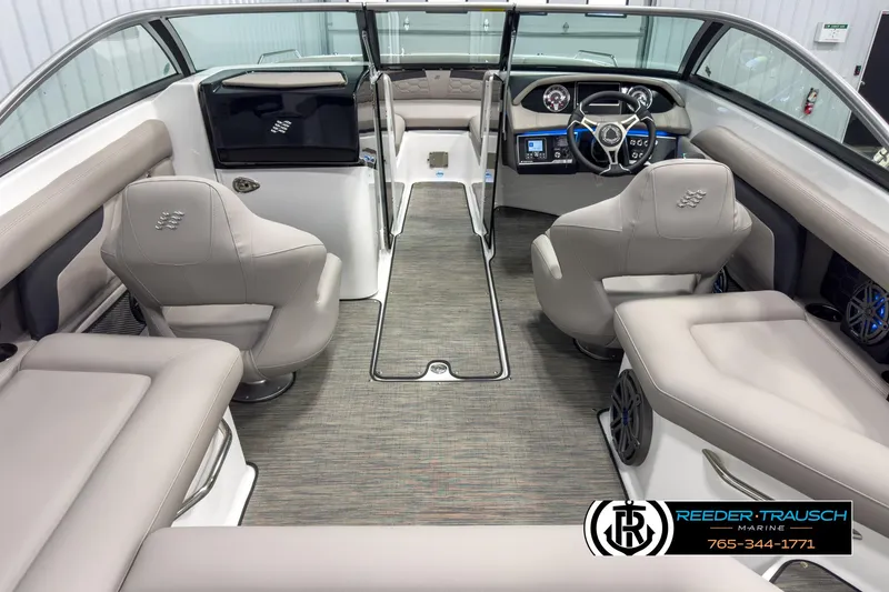 Slide: The Image of 2025 Four Winns HD3 boat interior with modern dashboard, plush seating, and sleek design. - 14
