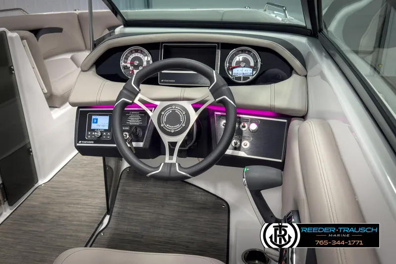 Slide: The Image of 2025 Four Winns HD3 boat dashboard with modern steering wheel and control panel. - 29
