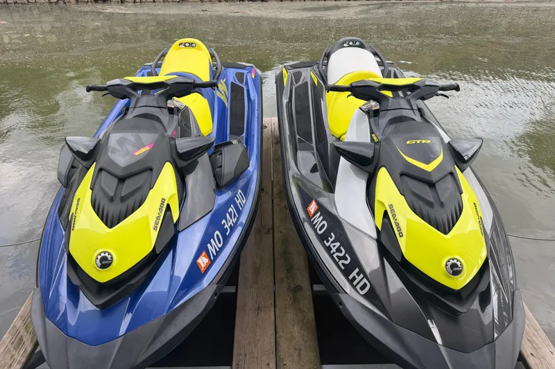 Slide: The Image of Two 2020 Sea-Doo Wake 170 jet skis docked by the water. - 11