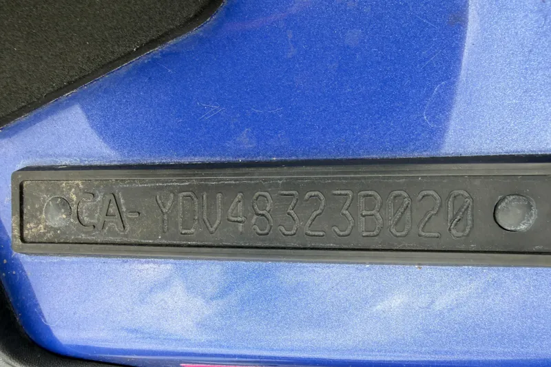Slide: The Image of Close-up of a 2020 Sea-Doo Wake 170 hull identification number on blue surface. - 13