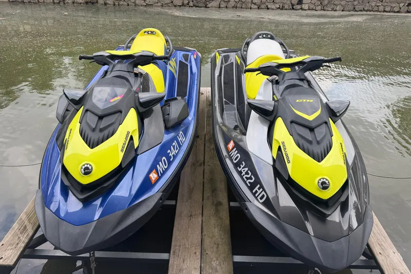 Slide: The Image of Two 2020 Sea-Doo Wake 170 jet skis docked on a wooden platform by the water. - 8