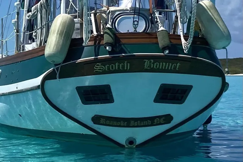 Slide: The Image of Sailboat "Scotch Bonnet" docked in clear blue water, Vagabond 42, 1983 model. - 18
