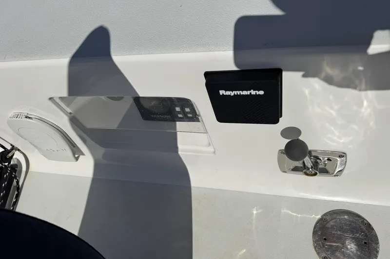 Slide: The Image of Control panel of a 2011 J Boats J/95 featuring Raymarine equipment. - 11