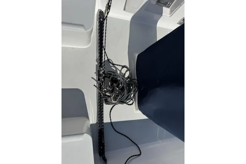 Slide: The Image of Deck view of a 2011 J Boats J/95 sailboat, featuring ropes and hardware. - 12