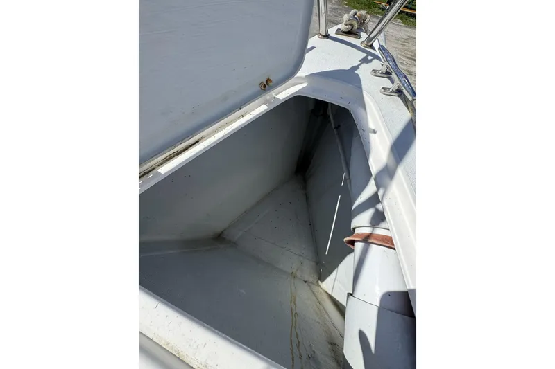 Slide: The Image of Open storage compartment on a 2011 J Boats J/95 sailboat deck. - 18