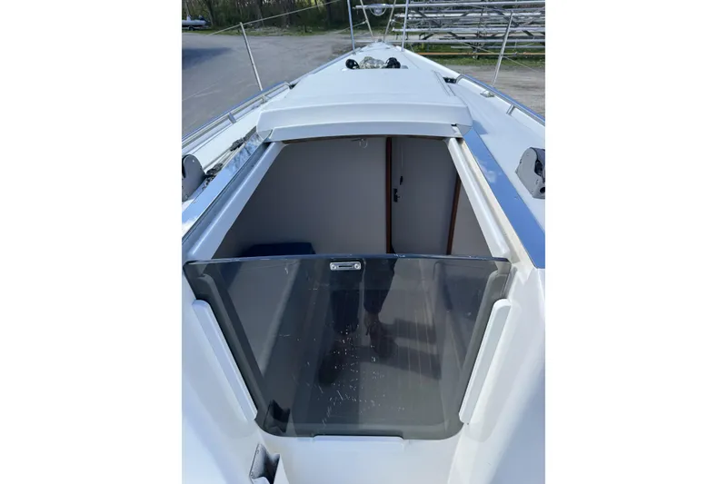 Slide: The Image of 2011 J Boats J/95 sailboat cockpit entrance with open hatch, showcasing sleek design. - 24