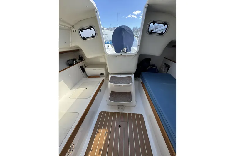 Slide: The Image of Interior view of 2011 J Boats J/95 sailboat cabin with seating and storage. - 25