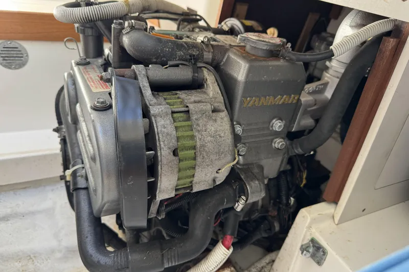Slide: The Image of Engine compartment of a 2011 J Boats J/95, featuring a Yanmar engine. - 29