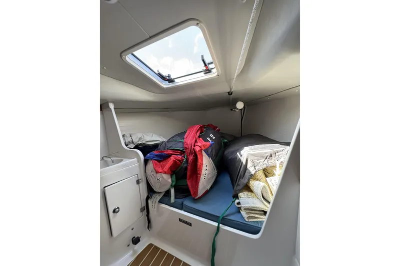Slide: The Image of Cozy cabin interior of 2011 J Boats J/95 sailboat with skylight and storage. - 33