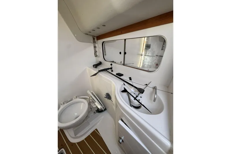 Slide: The Image of 2011 J Boats J/95 yacht bathroom with toilet, sink, and mirror. - 34