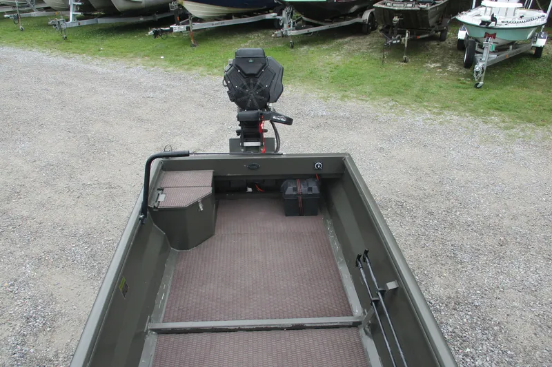 Slide: The Image of 2024 Gator Tail 1848 Gator Series boat with motor, parked on gravel. - 10
