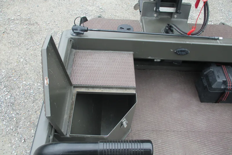 Slide: The Image of 2024 Gator Tail 1848 Gator Series boat interior with open storage compartment. - 3