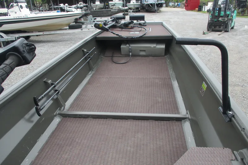 Slide: The Image of 2024 Gator Tail 1848 Gator Series boat interior with fishing rod holders and textured flooring. - 7