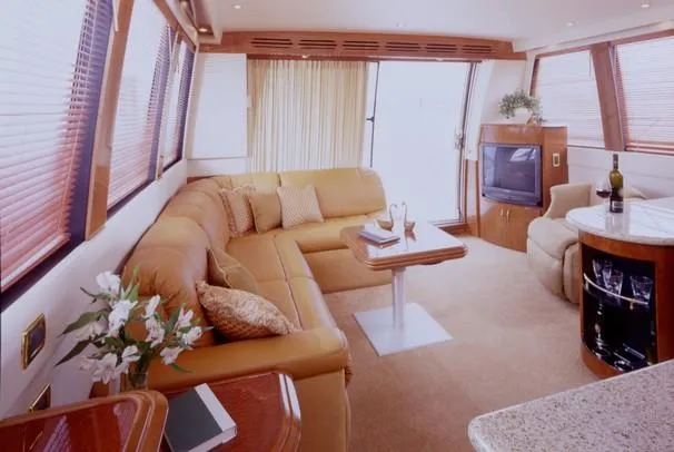 Slide: The Image of 2003 Carver 530 Voyager Pilothouse yacht cruising on open water. - 1