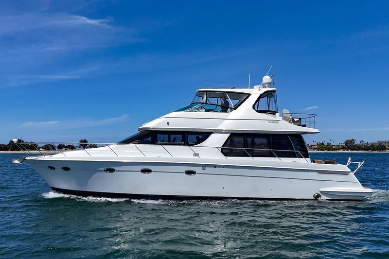 Slide: The Image of 2003 Carver 530 Voyager Pilothouse yacht cruising on a sunny day. - 21