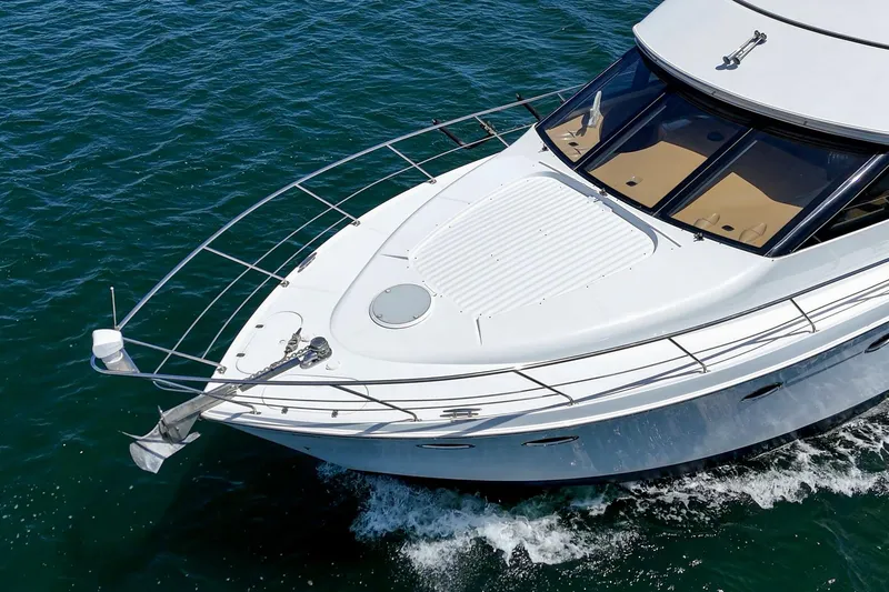 Slide: The Image of 2003 Carver 530 Voyager Pilothouse cruising on open water. - 25