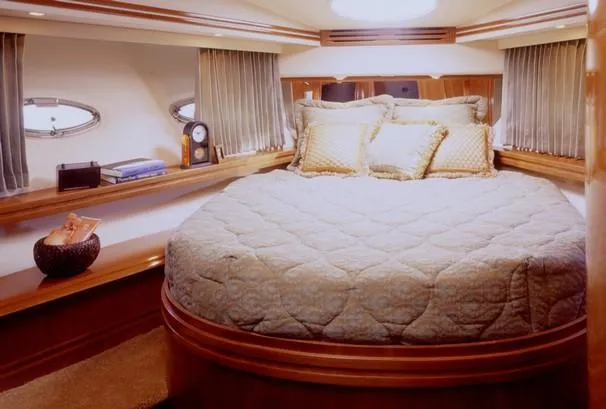 Slide: The Image of 2003 Carver 530 Voyager Pilothouse cruising on open water, aerial view. - 4
