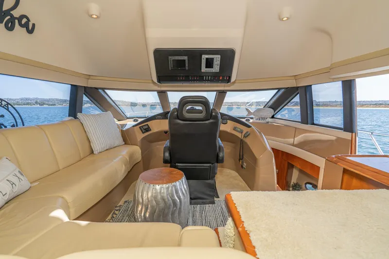 Slide: The Image of Luxurious interior of 2003 Carver 530 Voyager Pilothouse yacht with panoramic windows. - 40