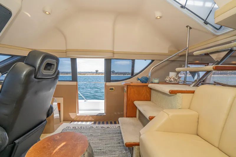Slide: The Image of Luxurious interior of 2003 Carver 530 Voyager Pilothouse with ocean view and elegant seating. - 44