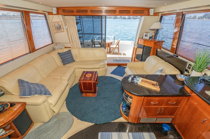 Slide: The Image of Luxurious interior of 2003 Carver 530 Voyager Pilothouse yacht with leather seating and ocean view. - 45