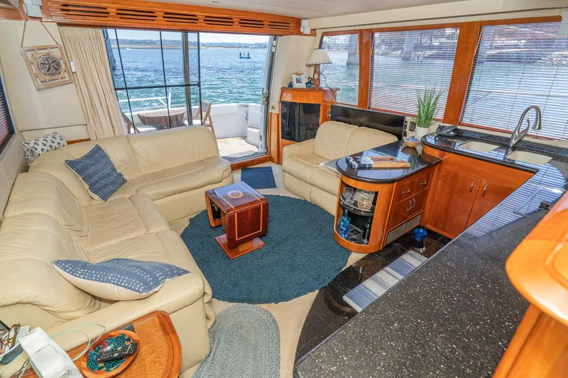 Slide: The Image of Luxurious interior of 2003 Carver 530 Voyager Pilothouse with leather seating and ocean view. - 46