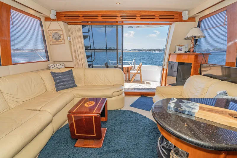 Slide: The Image of Luxurious interior of 2003 Carver 530 Voyager Pilothouse yacht with elegant seating and ocean view. - 47