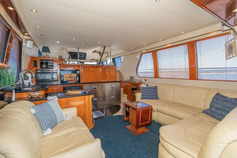 Slide: The Image of Luxurious interior of 2003 Carver 530 Voyager Pilothouse with leather seating and modern kitchen. - 48
