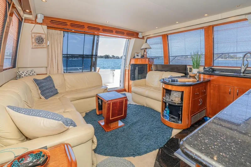 Slide: The Image of Luxurious interior of 2003 Carver 530 Voyager Pilothouse yacht with leather seating and ocean view. - 49