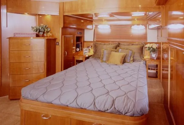 Slide: The Image of 2003 Carver 530 Voyager Pilothouse yacht cruising on open water. - 5