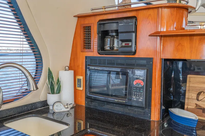 Slide: The Image of Kitchen area of 2003 Carver 530 Voyager Pilothouse with coffee maker and microwave. - 50