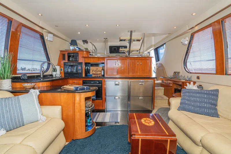 Slide: The Image of Luxurious interior of 2003 Carver 530 Voyager Pilothouse with elegant wood finishes and modern amenities. - 53