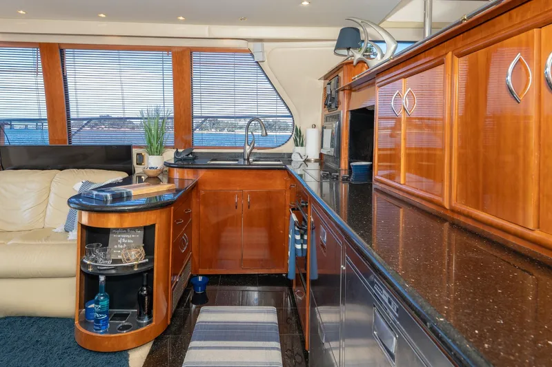 Slide: The Image of Luxurious interior of 2003 Carver 530 Voyager Pilothouse with elegant wood cabinetry and modern amenities. - 54