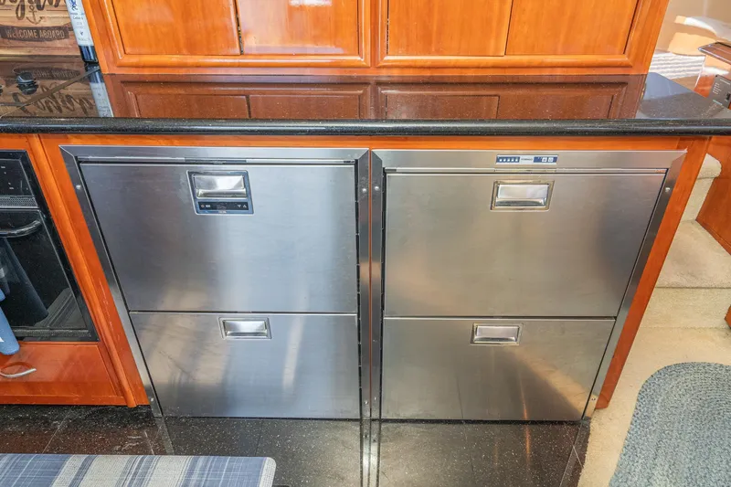 Slide: The Image of Stainless steel appliances in 2003 Carver 530 Voyager Pilothouse kitchen interior. - 55
