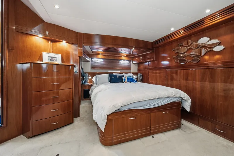 Slide: The Image of Luxurious 2003 Carver 530 Voyager Pilothouse bedroom with elegant wood finish and modern decor. - 61
