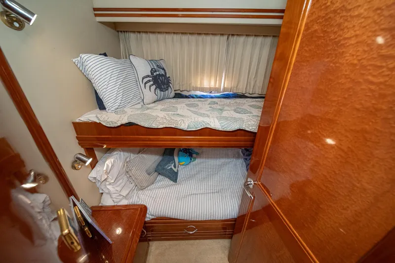 Slide: The Image of Bunk beds in 2003 Carver 530 Voyager Pilothouse cabin with nautical-themed bedding. - 64